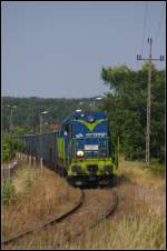 PKP Cargo SM31-130 / 8 620 060 schiebt am 09.07.2013 einen langen Zug Eaos-Wagen ber das Verbindungsgleis auf den unteren Rangierbahnhof von Kostrzyn
