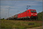 db-cargo/580126/db-cargo-185-368-8-fuhr-mit DB Cargo 185 368-8 fuhr mit einem Kesselwagenzug am 30.08.2017 durch die Berliner Wuhlheide