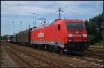 db-schenker/210708/db-schenker-185-209-4-mit-einem DB Schenker 185 209-4 mit einem Stckgutzug in dem ein Regiowagen eingereiht war am 24.07.2012 in Nuthetal-Saarmund