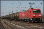 KW 12/60826/railion-185-207-8-mit-gemischtem-gueterzug Railion 185 207-8 mit gemischtem Gterzug (TRAXX F140 AC2, DB Schenker Rail Deutschland AG, gesehen Wustermark-Priort 25.03.2010)
