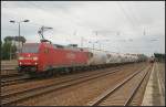 DB Schenker 152 002-2 mit Staubgutwagen und Rungenwagen unterwegs am 17.07.2011 in Berlin Schönefeld Flughafen.