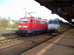 TX Logistik 185 531-1 mit Containerzug zieht an 111 100-4 vorbei (Angemietet von ATC Antwerpen, gesichtet Bebra 22.04.2007).